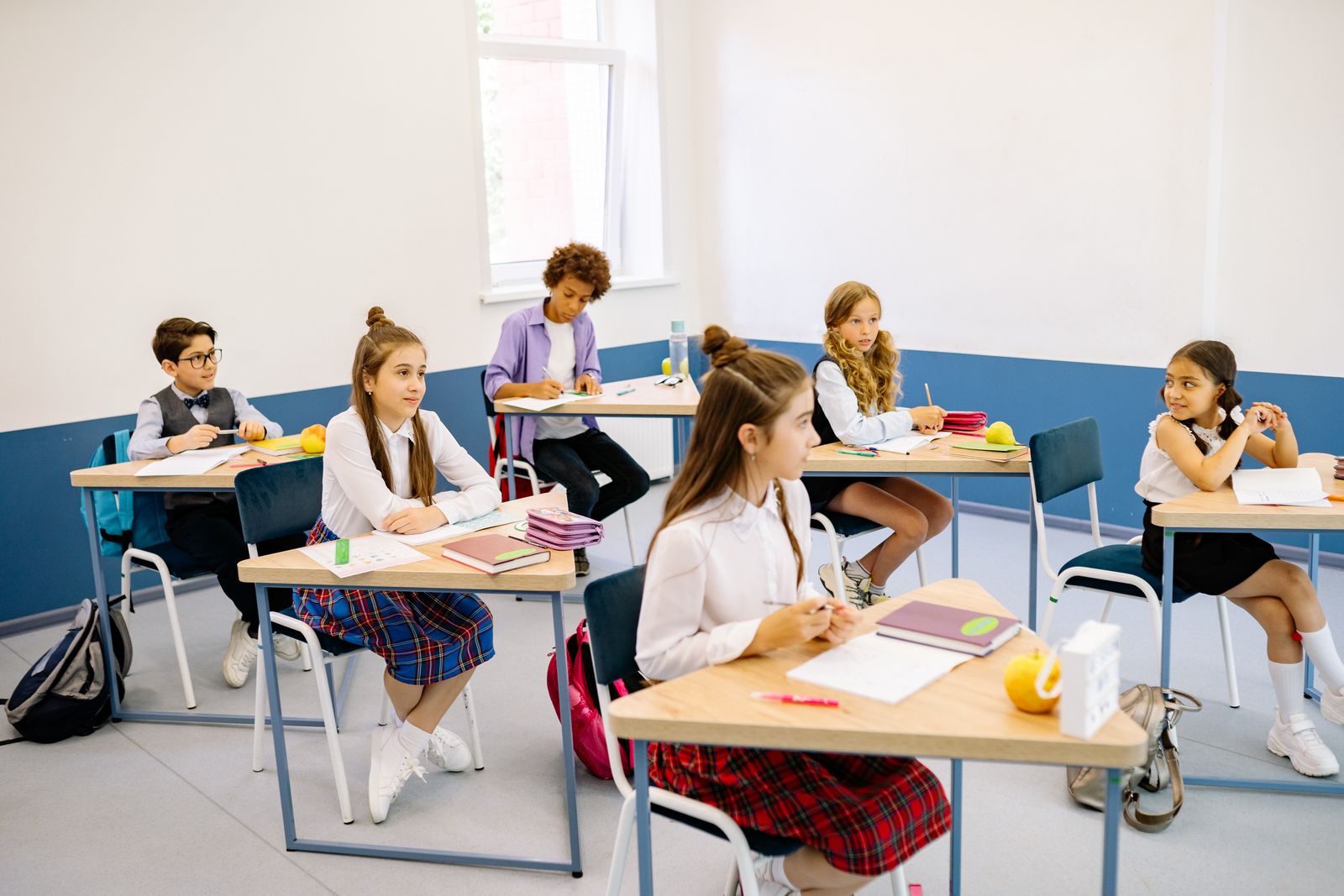 Students working attentively in a bright, welcoming classroom at Green Valley.