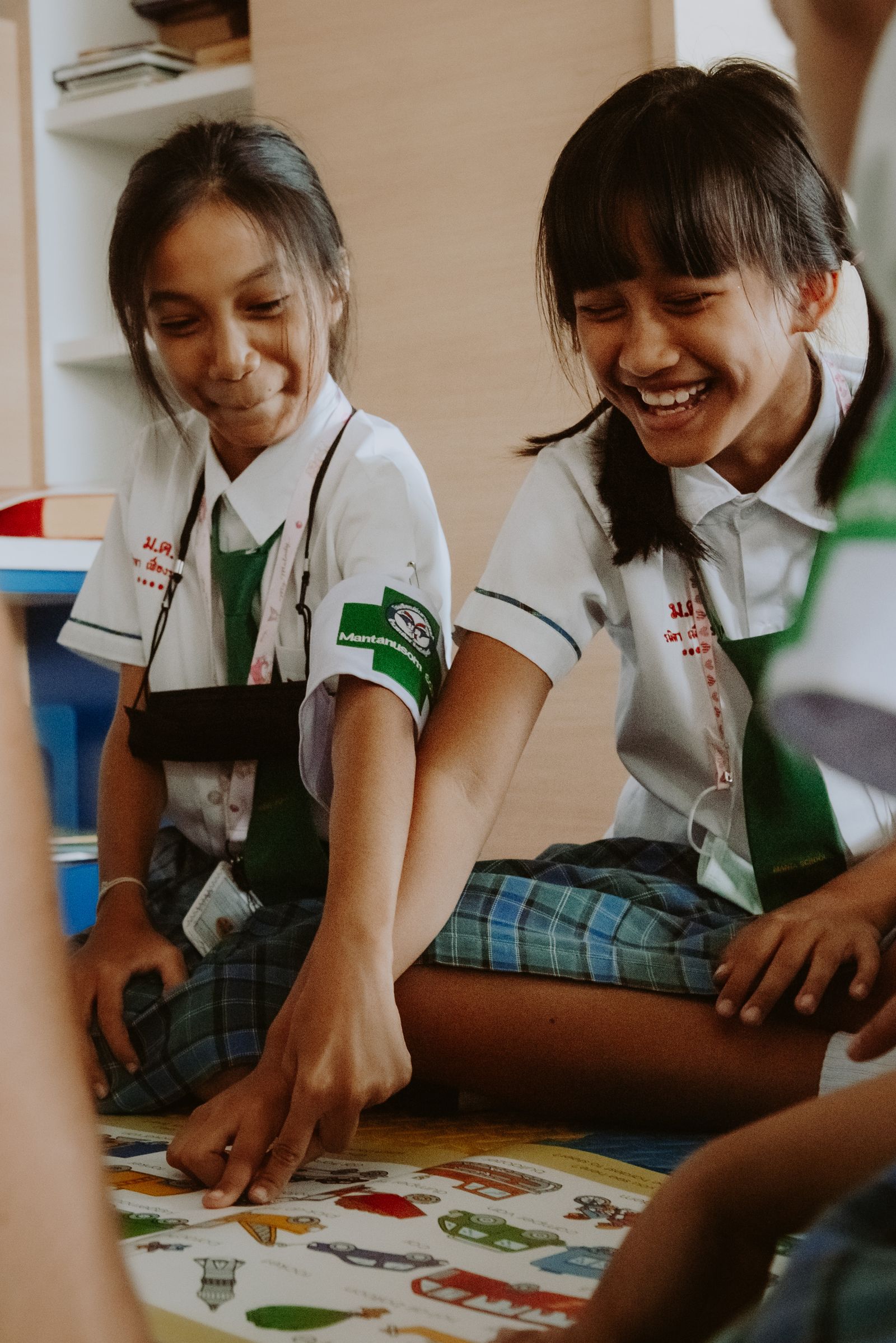 Young primary-age children enjoying a classroom activity.